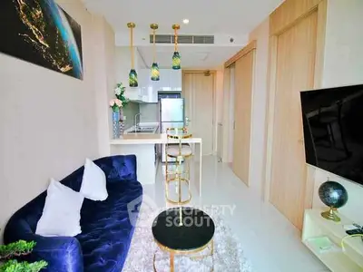 Modern living room with stylish decor and open kitchen layout in a luxury apartment.