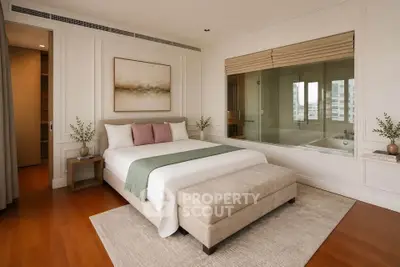 Luxurious bedroom with elegant decor and large window overlooking cityscape.
