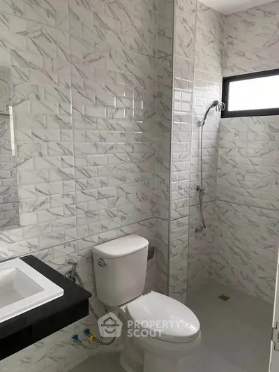 Modern bathroom with sleek tiles and contemporary fixtures