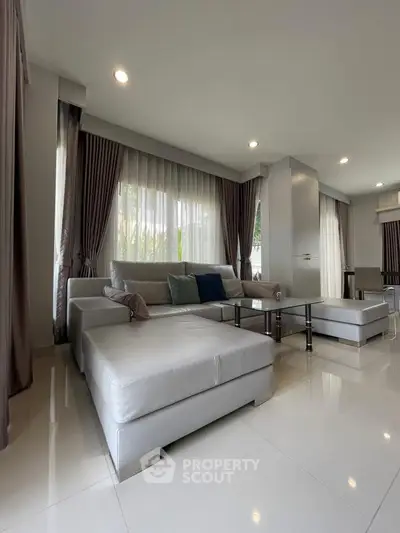 Spacious modern living room with elegant decor and natural light