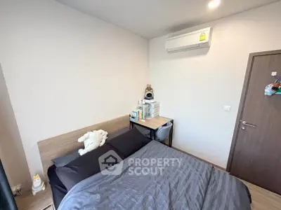 Cozy bedroom with modern air conditioning and stylish decor