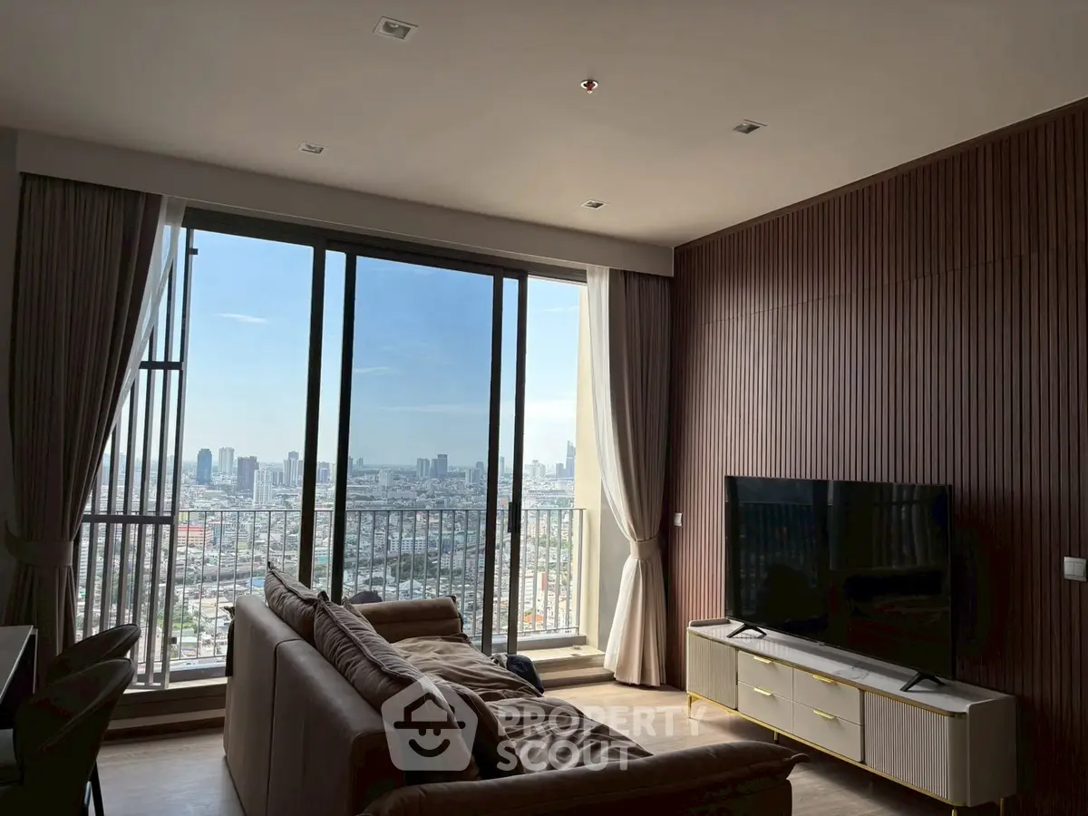 Spacious living room with stunning city view and modern decor