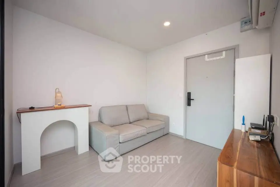 Modern minimalist living room with cozy sofa and sleek wooden furniture