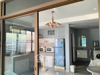 Charming kitchen with vintage fridge and open layout, perfect for cozy living.