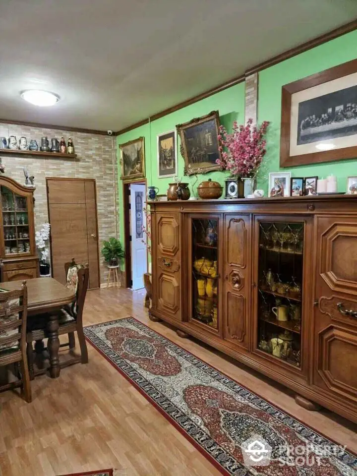 Charming vintage dining room with wooden furniture and classic decor.