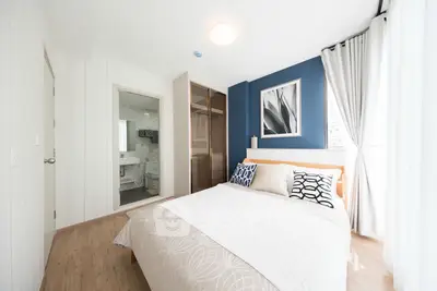 Modern bedroom with ensuite bathroom and stylish decor