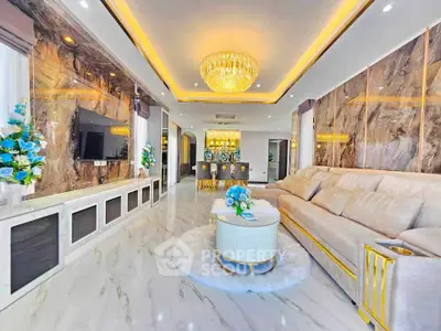 Luxurious living room with elegant chandelier and marble accents