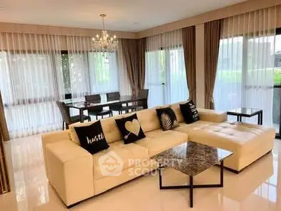 Luxurious living room with elegant chandelier and spacious seating area