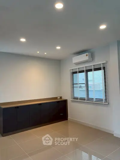 Modern interior with sleek cabinetry and air conditioning, perfect for a stylish living space.