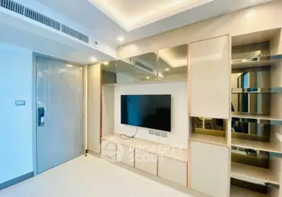 Modern living room with sleek TV unit and ambient lighting