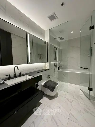 Luxurious modern bathroom with sleek design and glass shower enclosure