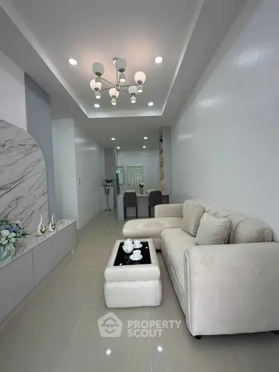 Modern living room with elegant decor and cozy seating area