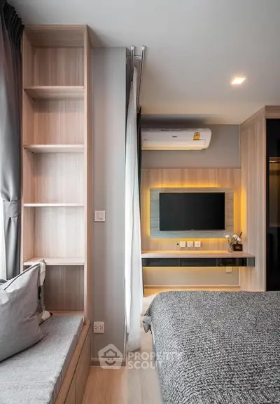 Modern bedroom with built-in shelves and wall-mounted TV, featuring sleek design and cozy ambiance.