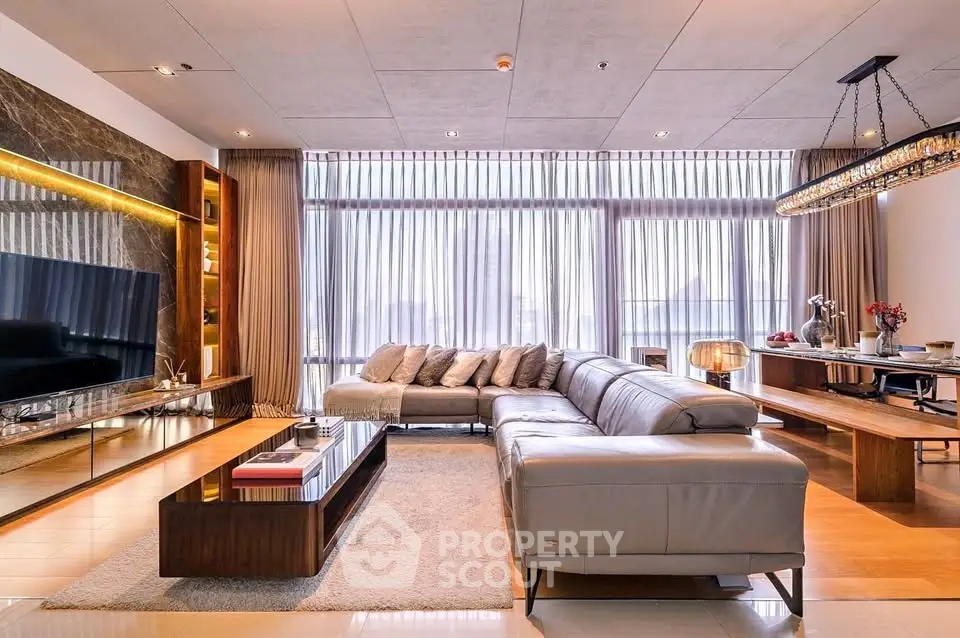 Luxurious modern living room with elegant decor and spacious seating area.