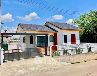 Charming single-story house with modern design and spacious driveway in a serene neighborhood.
