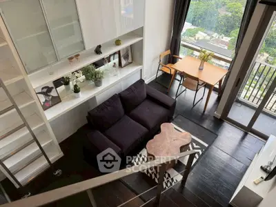 Modern living room with balcony view, sleek furniture, and stylish decor