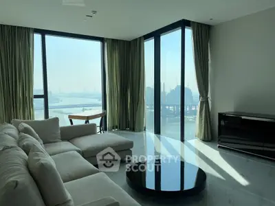 Luxurious living room with panoramic city view and modern furnishings