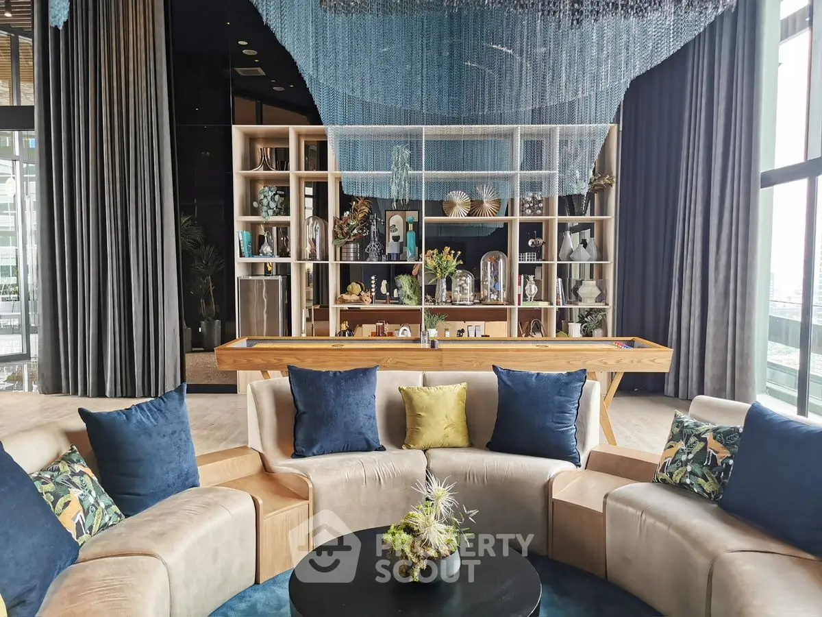 Luxurious modern living room with elegant decor and large windows offering natural light.