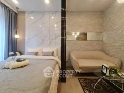 Modern bedroom with stylish decor and cozy seating area, perfect for relaxation.