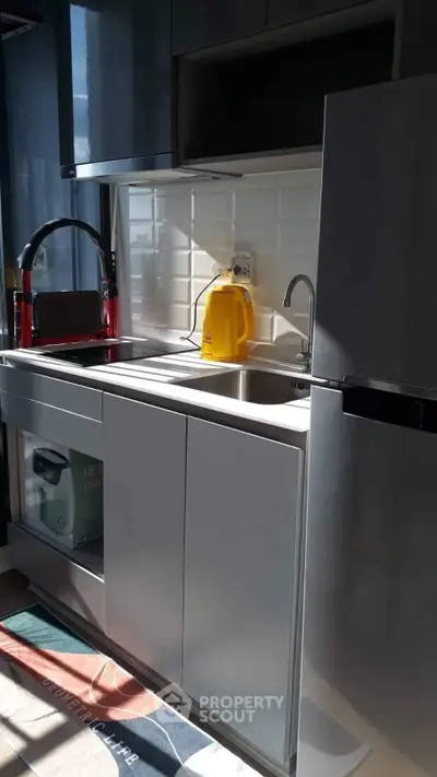 Modern kitchen with sleek cabinetry and stainless steel appliances