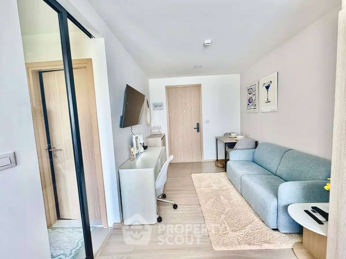 Modern living room with sleek furniture and stylish decor in a cozy apartment.