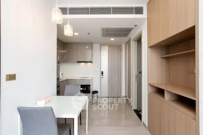 Modern apartment interior with dining area and open kitchen layout