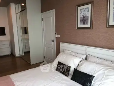 Elegant bedroom with modern decor and mirrored wardrobe doors