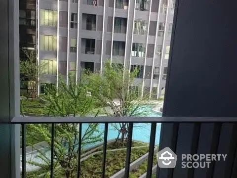 Modern apartment view with pool and garden from balcony