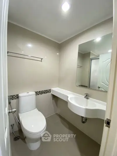 Modern bathroom with sleek fixtures and neutral tones