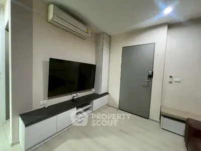 Modern living room with sleek TV unit and air conditioning