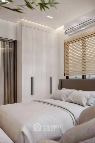 Modern bedroom with sleek design, featuring built-in wardrobe and cozy bedding, perfect for relaxation.