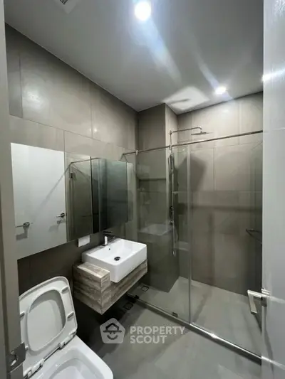 Modern bathroom with sleek design and glass shower enclosure