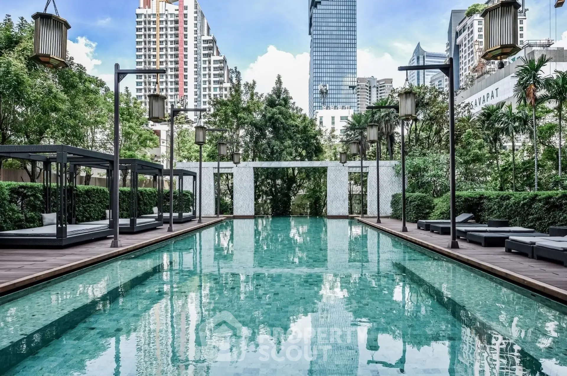 Luxurious urban pool area with modern design and city skyline views, perfect for relaxation and leisure.