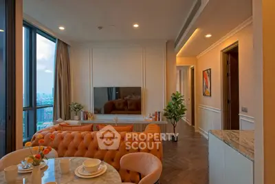 Luxurious living room with city view, elegant furniture, and modern decor in high-rise apartment.