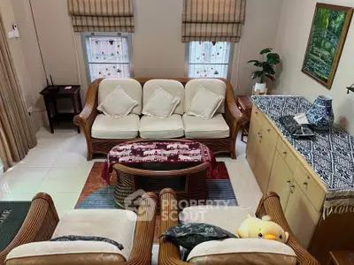 Charming living room with cozy wicker furniture and elegant decor