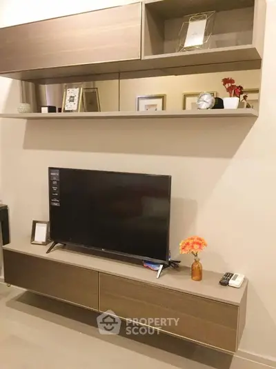 Modern living room with sleek TV unit and stylish shelving