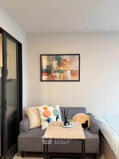 Cozy living room with modern decor and stylish artwork, perfect for relaxation and comfort.