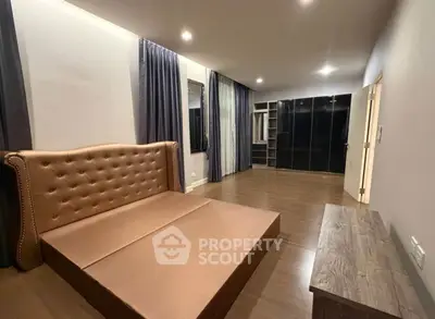 Spacious bedroom with elegant bed and ample closet space