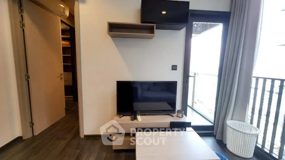 Modern living room with balcony access and stylish decor