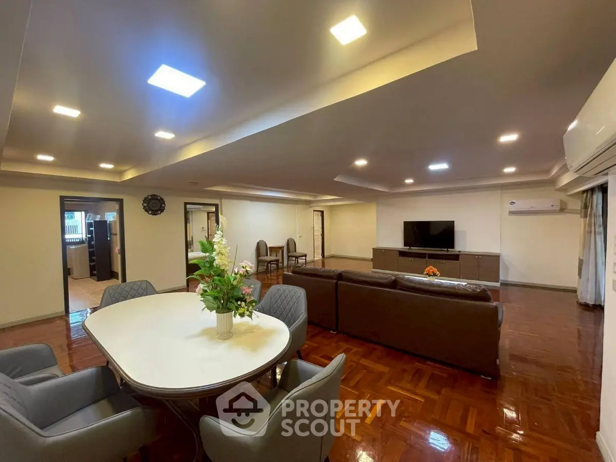 Spacious living room with modern furniture and elegant lighting