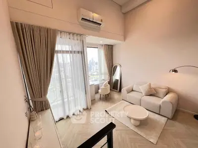 Modern living room with city view, featuring elegant decor and cozy seating area.