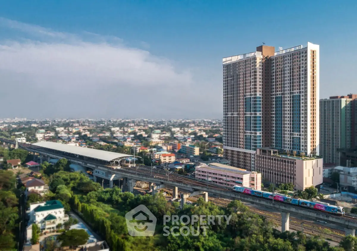 Stunning high-rise building with panoramic city views and nearby train station, perfect for urban living.