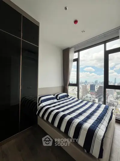 Modern bedroom with stunning city view and large window