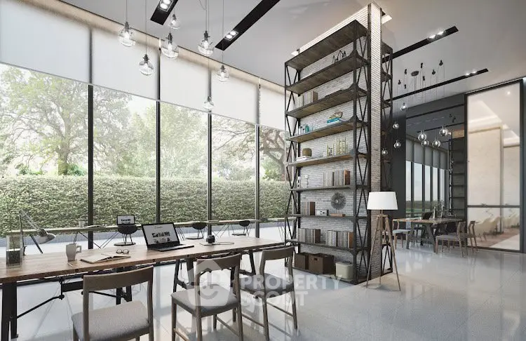 Modern co-working space with large windows and stylish decor