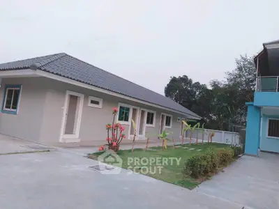 Charming single-story home with modern design and lush garden in serene neighborhood.