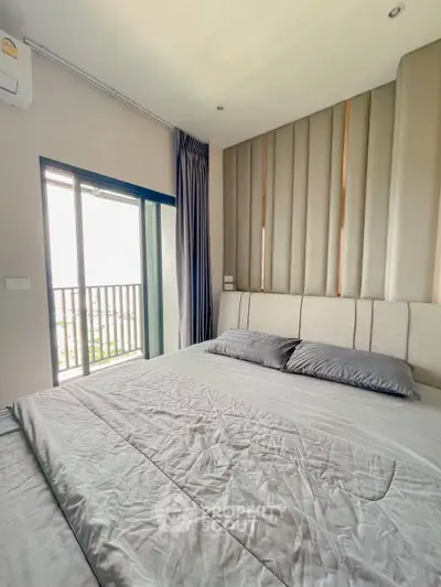 Modern bedroom with balcony access and stylish decor