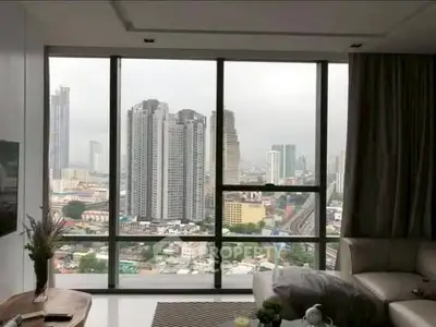 Luxurious living room with stunning city view through large windows.