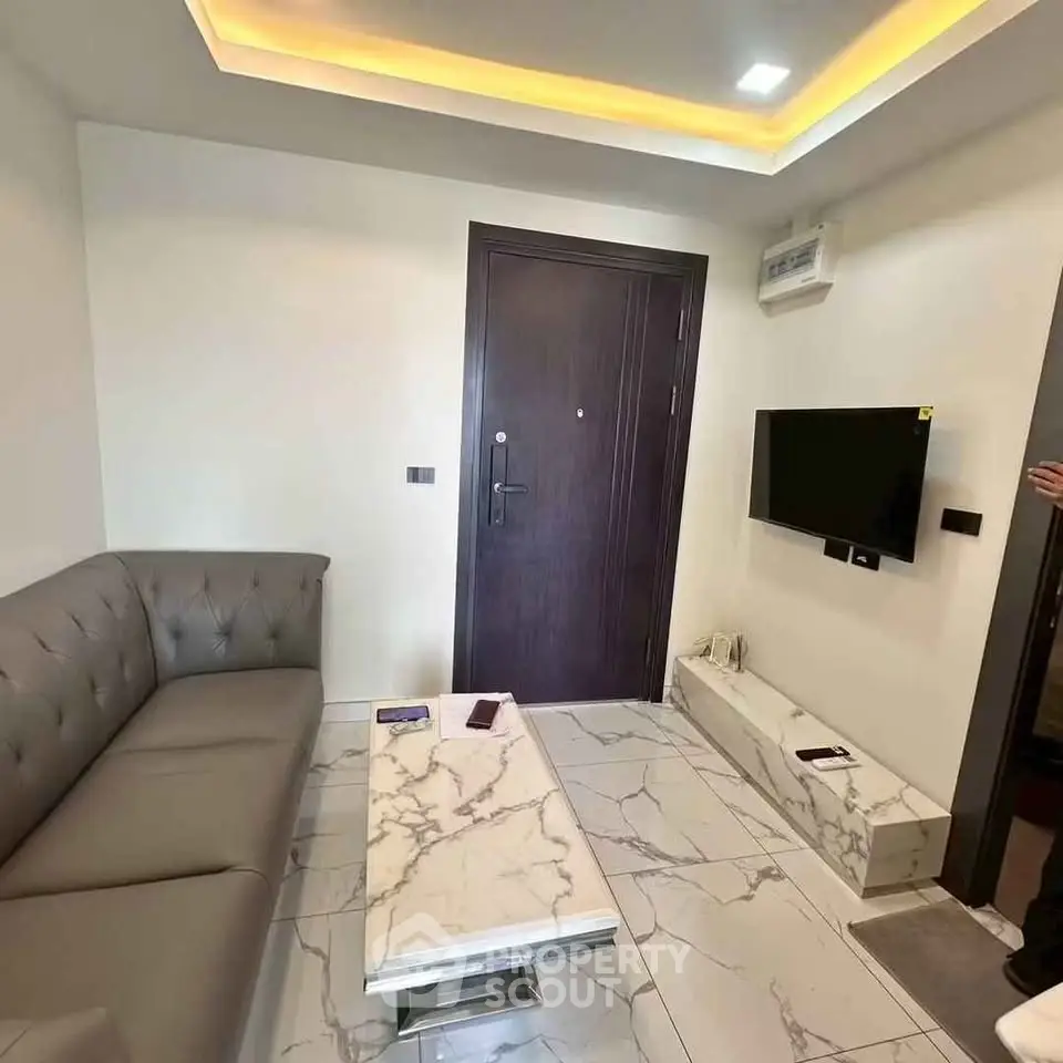 Modern living room with elegant marble flooring and sleek furniture
