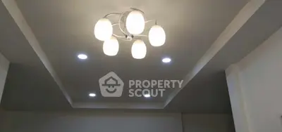 Modern ceiling design with stylish lighting fixtures in a contemporary home interior.