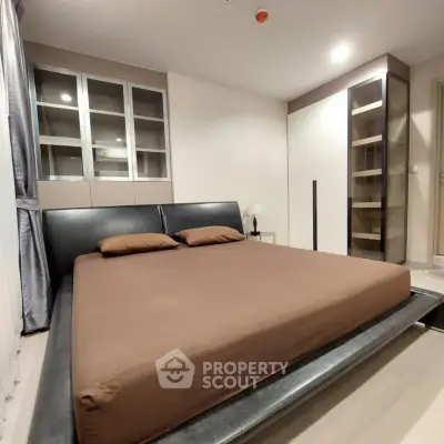 Modern bedroom with sleek design and ample storage in luxury apartment
